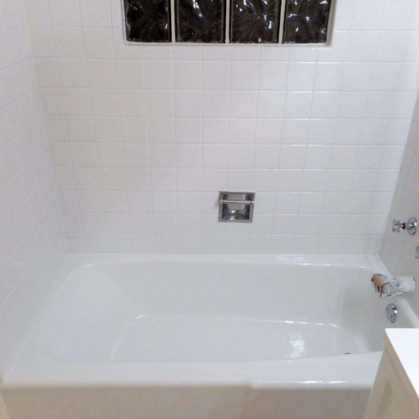 Bathtub and ceramic shower tile surround refinished in a high gloss white in Naperville, IL.