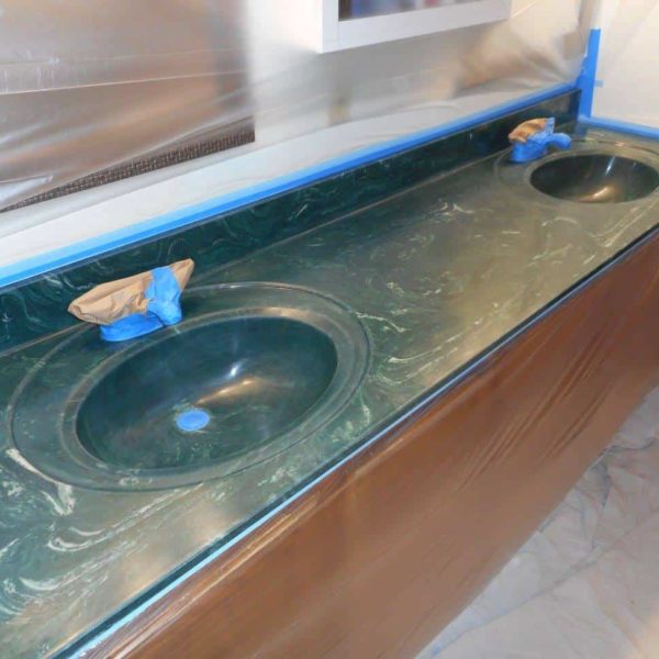 Out of date green cultured marble double bowl vanity top before refinishing in Naperville, IL.